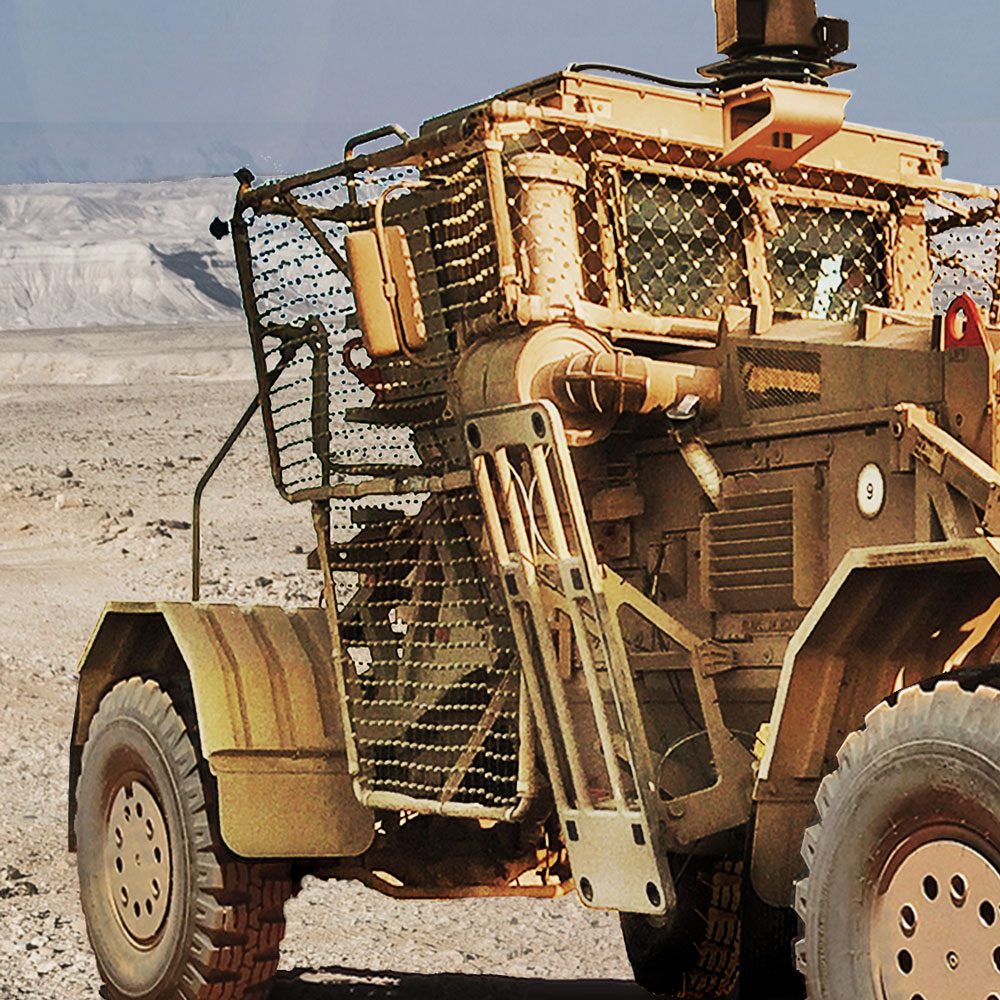 Side of Husky with RPG protection netting on the side